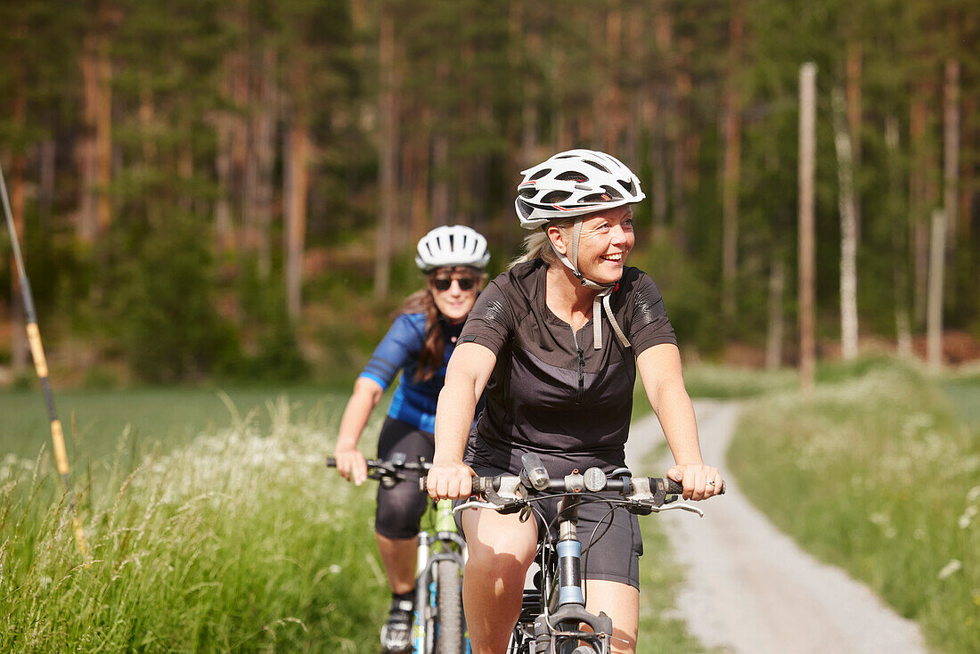 Smiling woman cycling