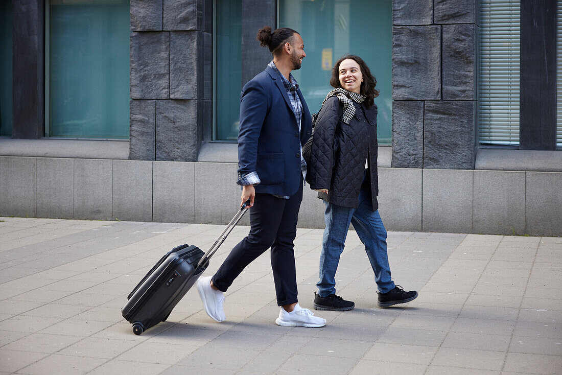 Smiling couple walking together