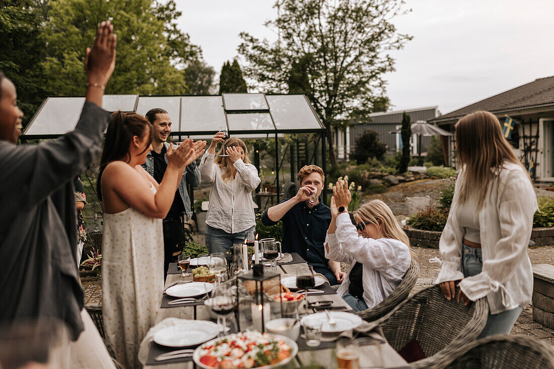 Friends having meal in garden