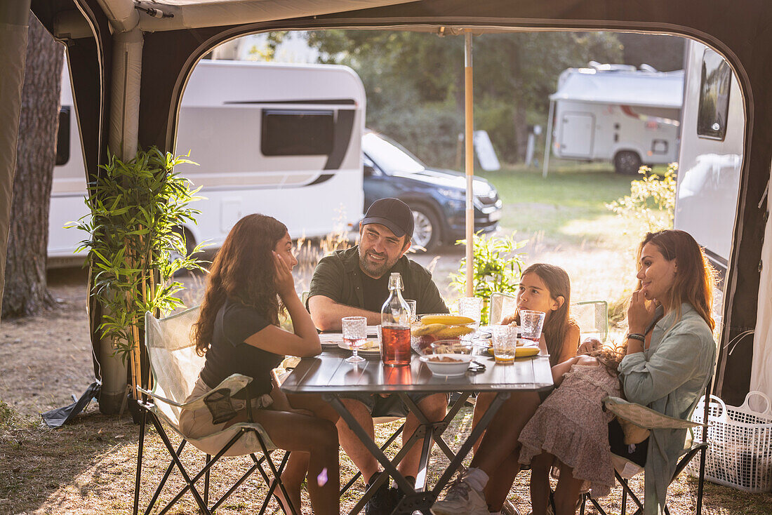 Family having meal at camping