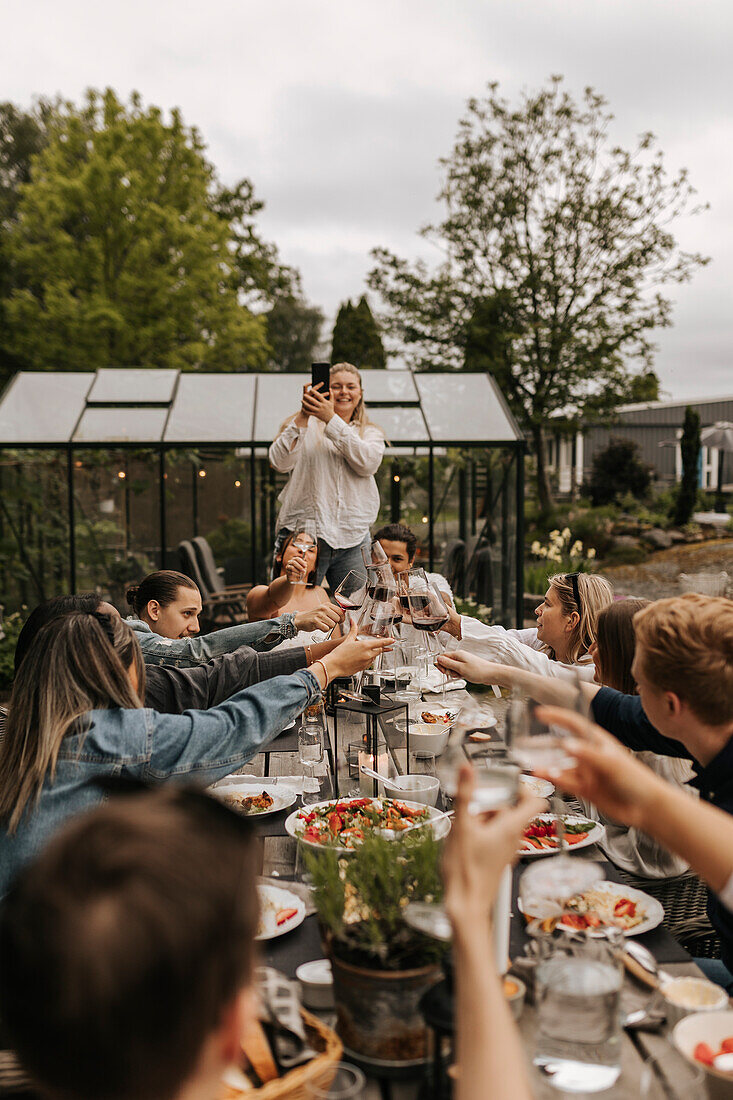 Friends having meal in garden