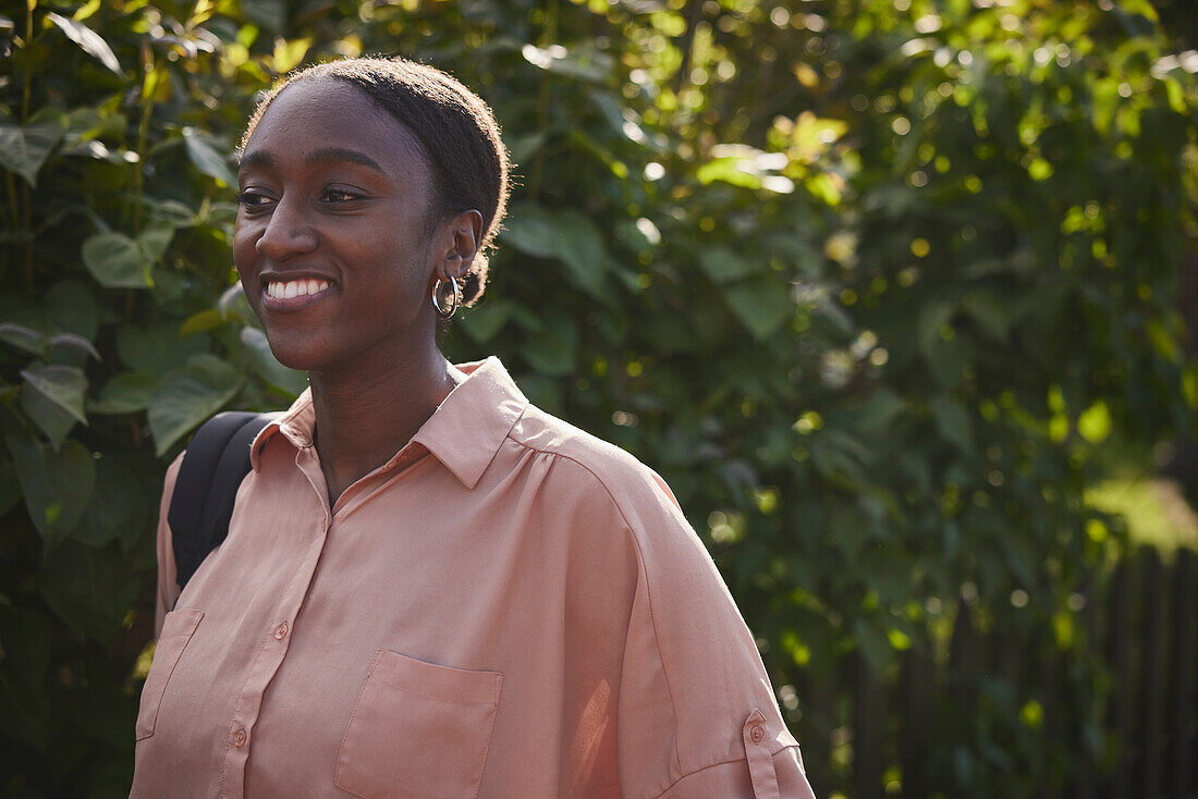 Smiling young woman looking away