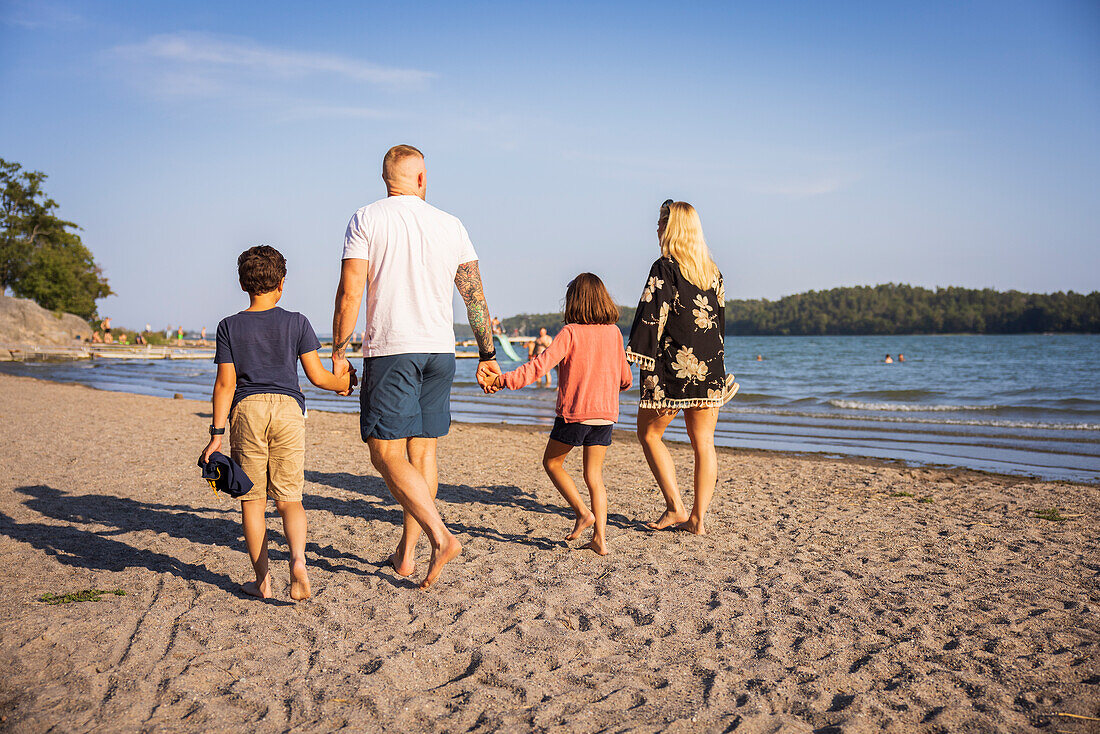 Family walking together at beach