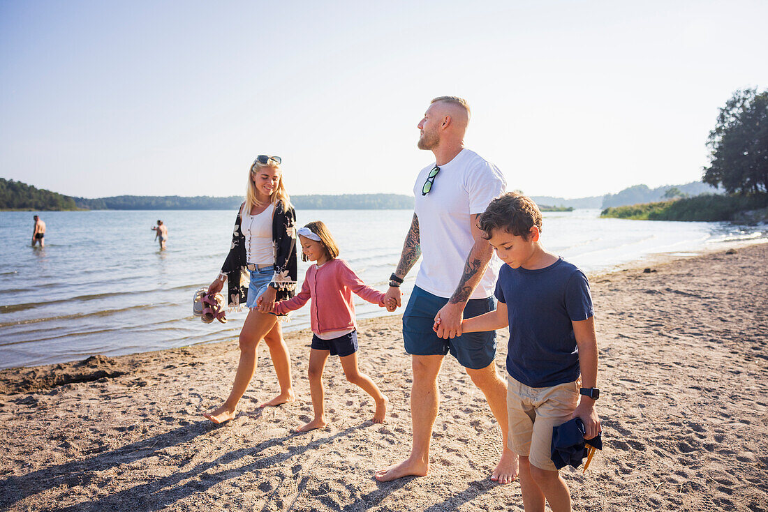 Family walking together at beach