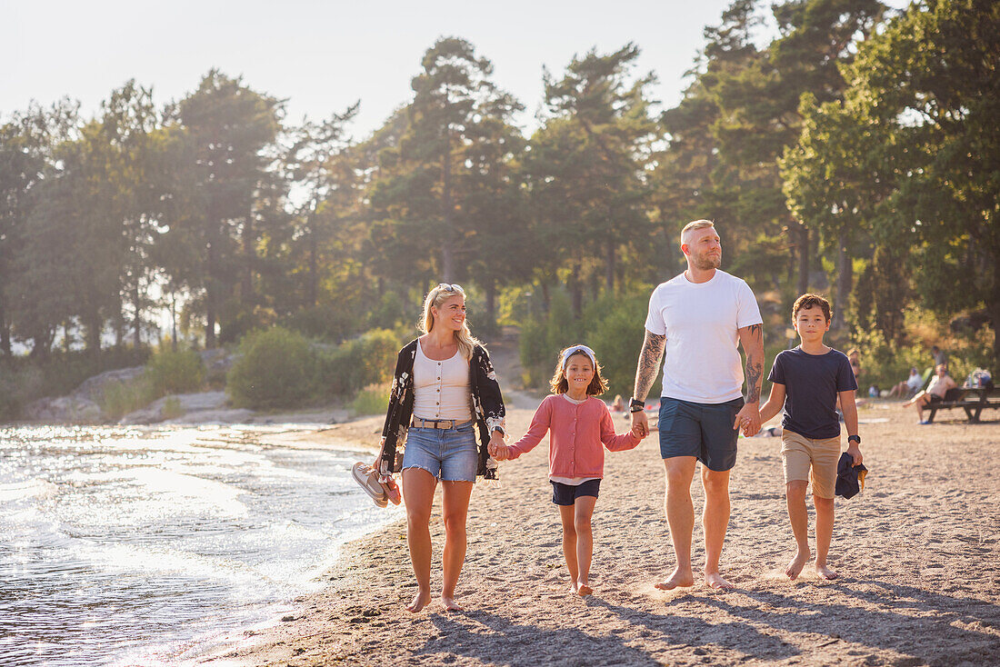 Family walking together at beach