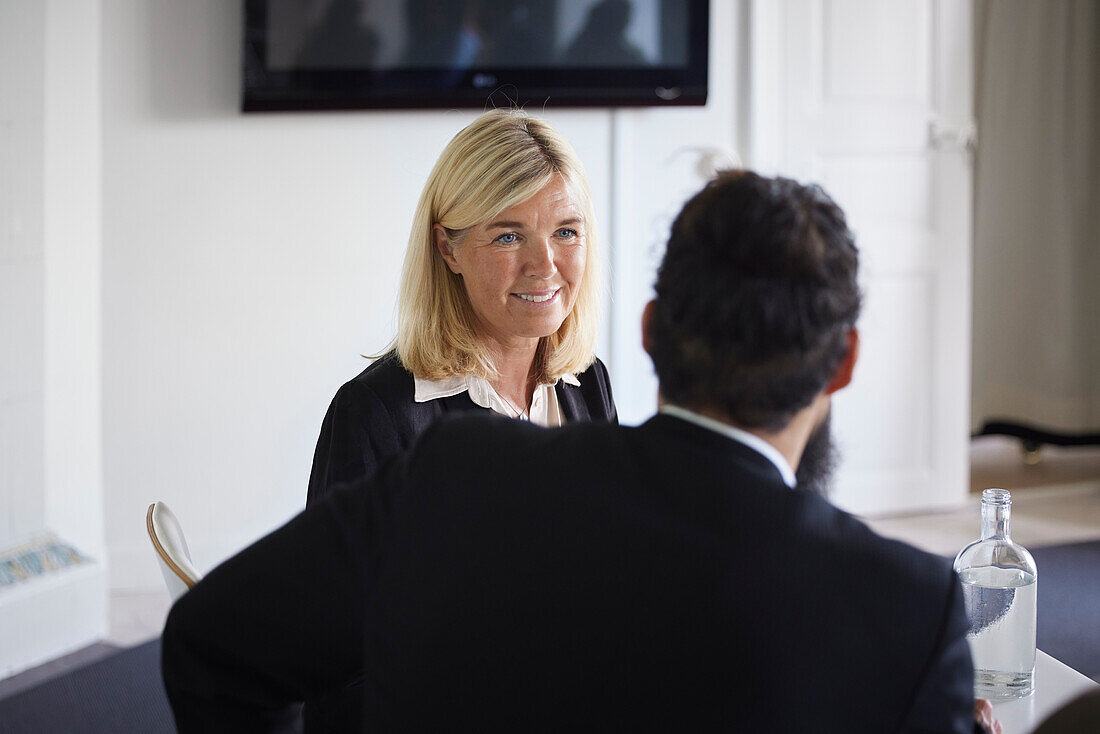 Smiling businesswoman at meeting