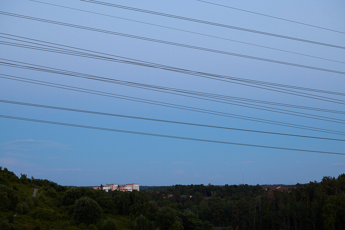 Electricity cables against sky
