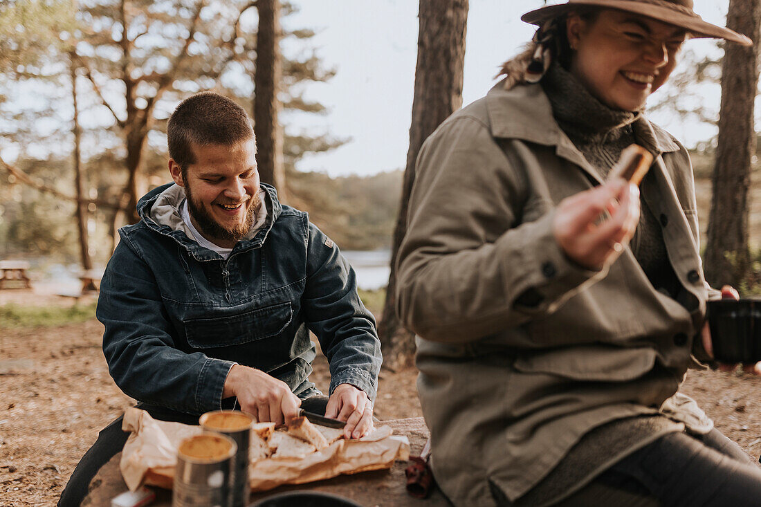 Couple having picnic at lake