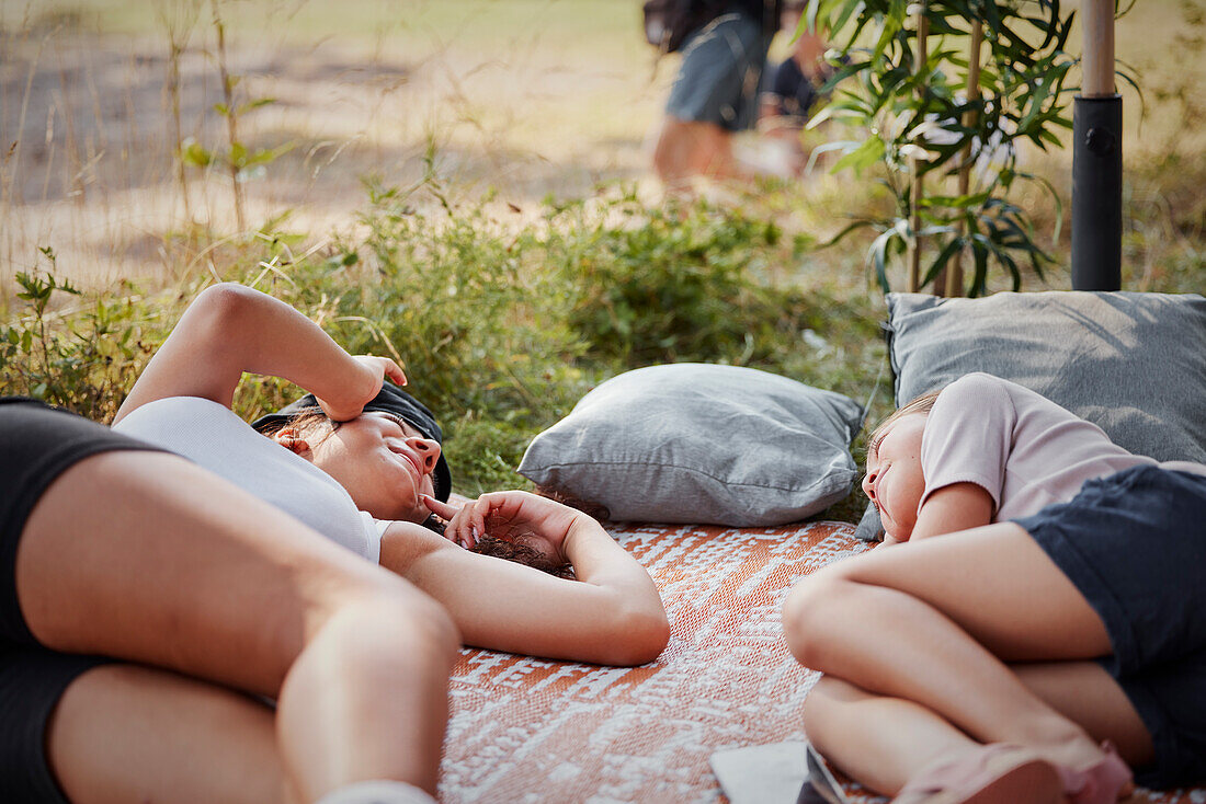 Girls lying down on blanket