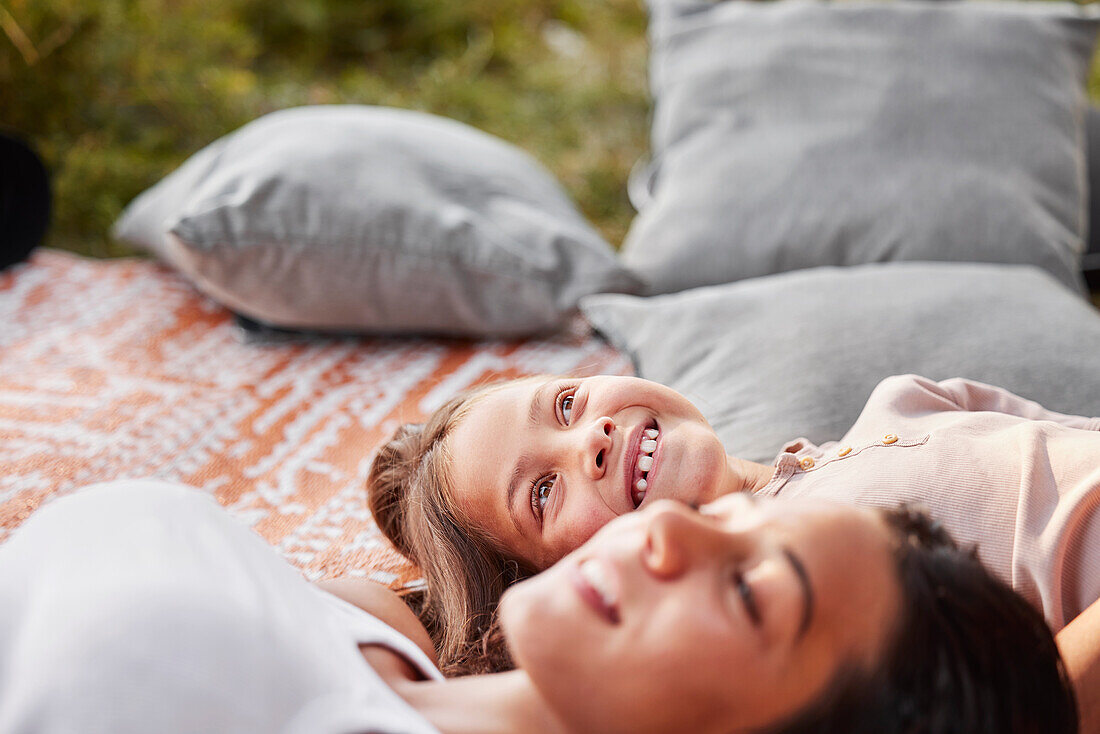 Girls lying down on blanket