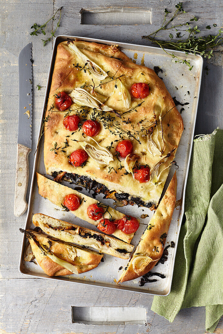 Mushroom stuffed focaccia with fennel and tomatoes
