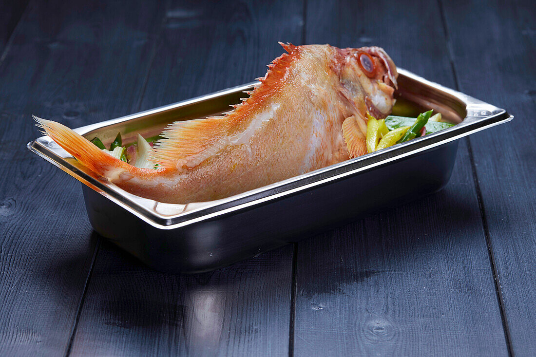 Fresh redfish in a metal pan