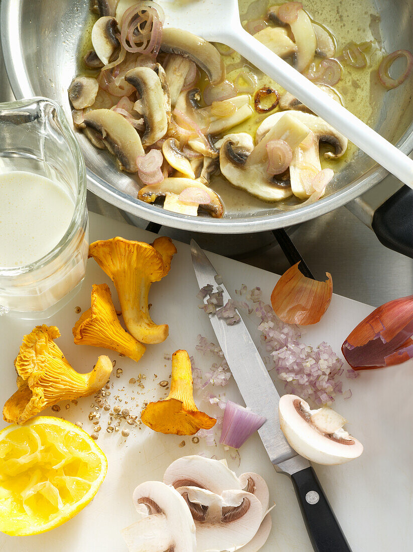 Mushrooms being fried in a pan