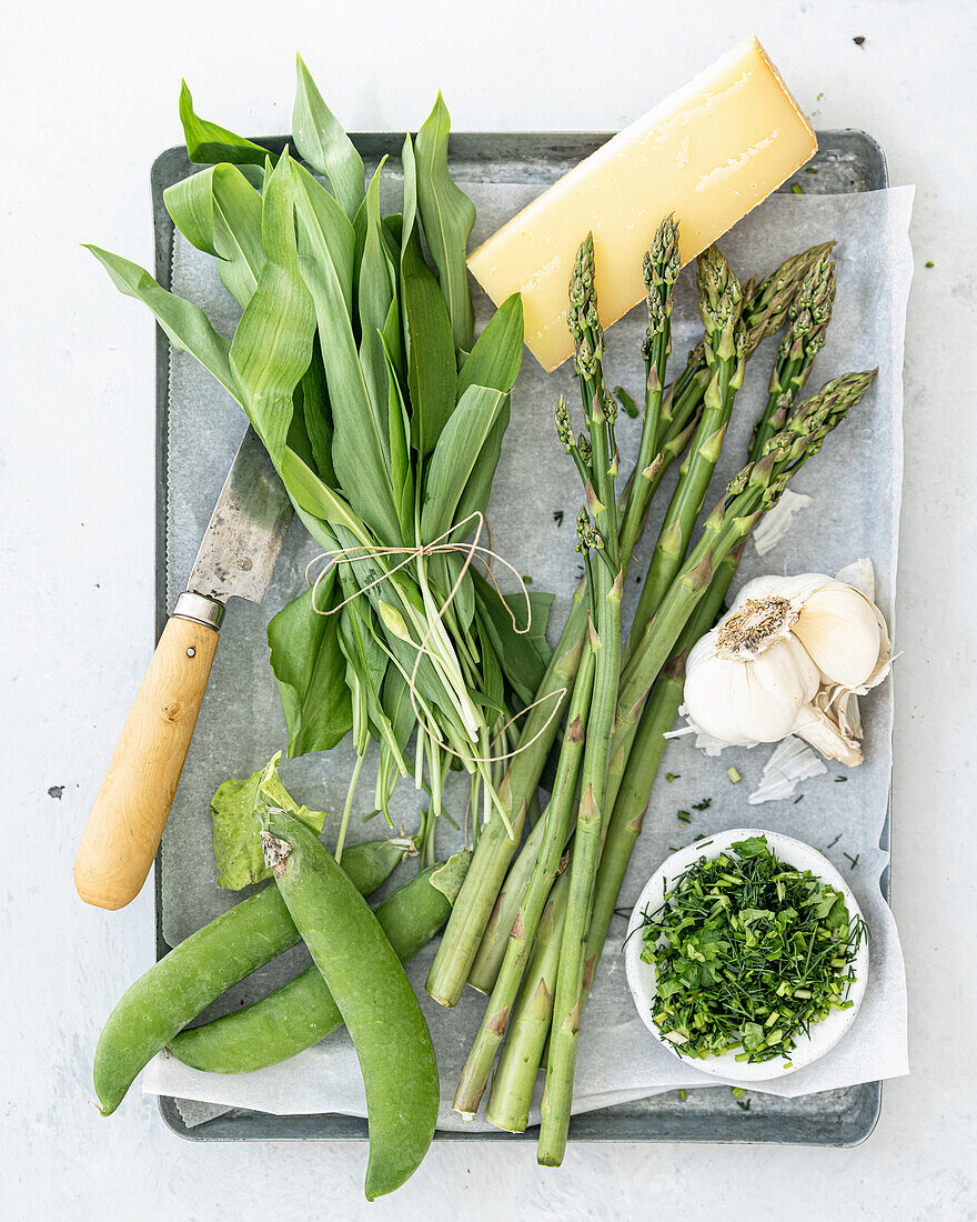 Fresh wild garlic, asparagus, peas, garlic, herbs and cheese