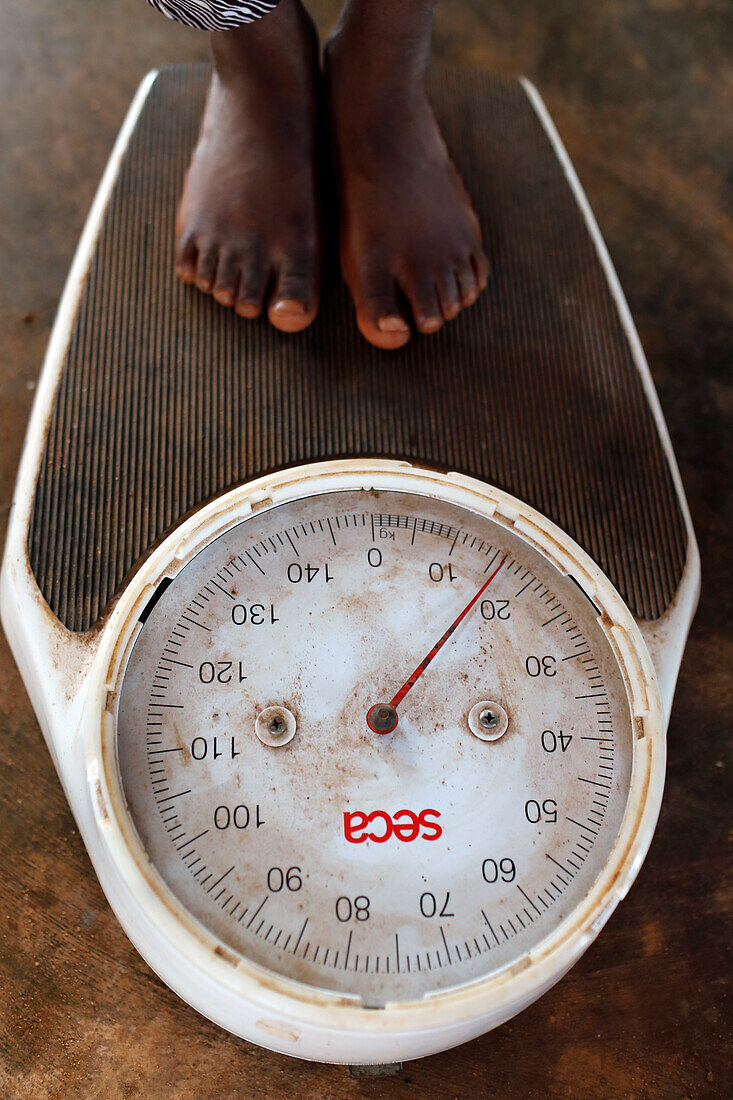 Boy being weighed