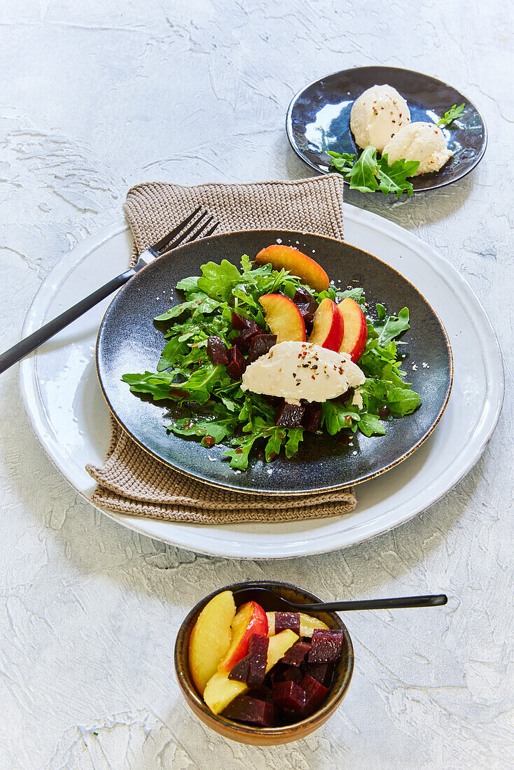 Salad with trout mousse, peach and beets