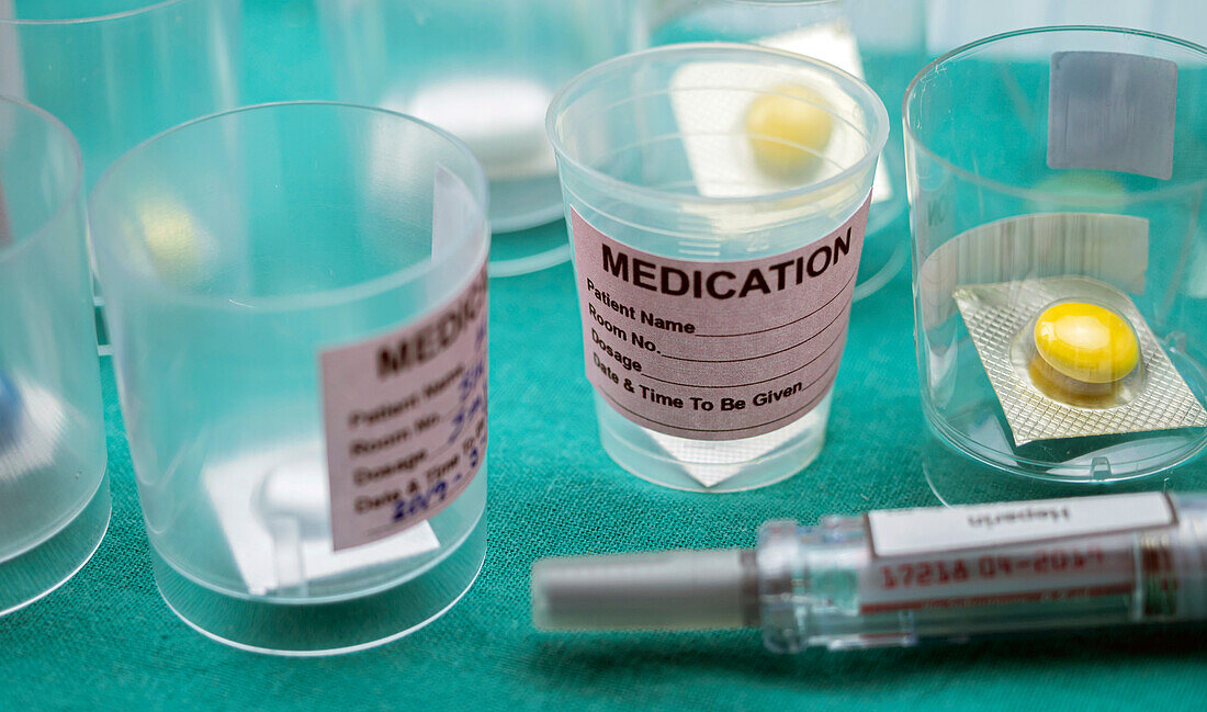Medication sorted in glasses, conceptual image