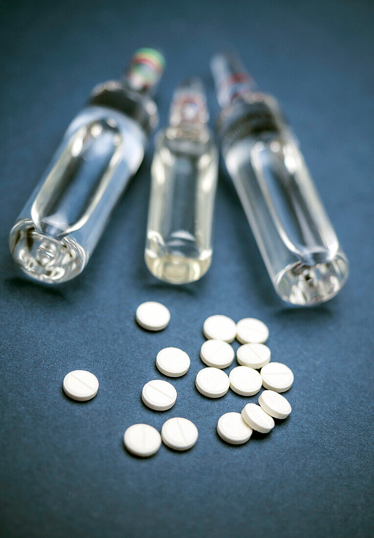 Tablets and vials, conceptual image