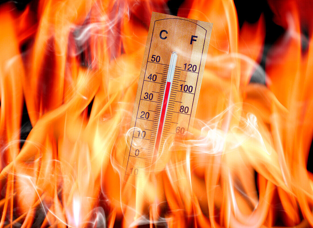 Thermometer in flames, conceptual image