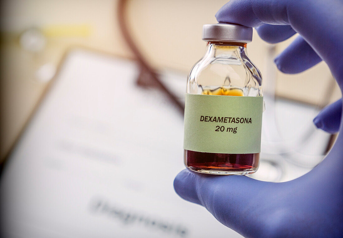 Doctor holding vial of dexamethasone