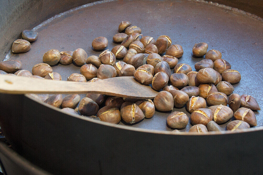 Hot chestnuts being roasted