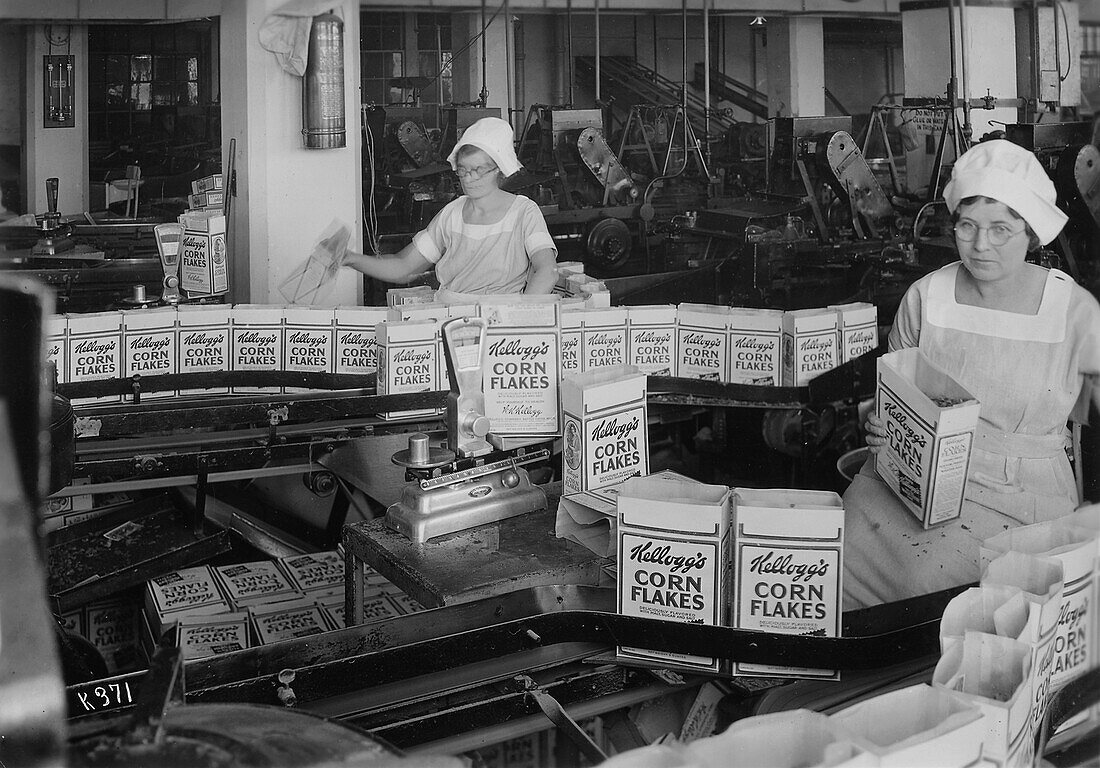 Women inspecting filled boxes of cereal