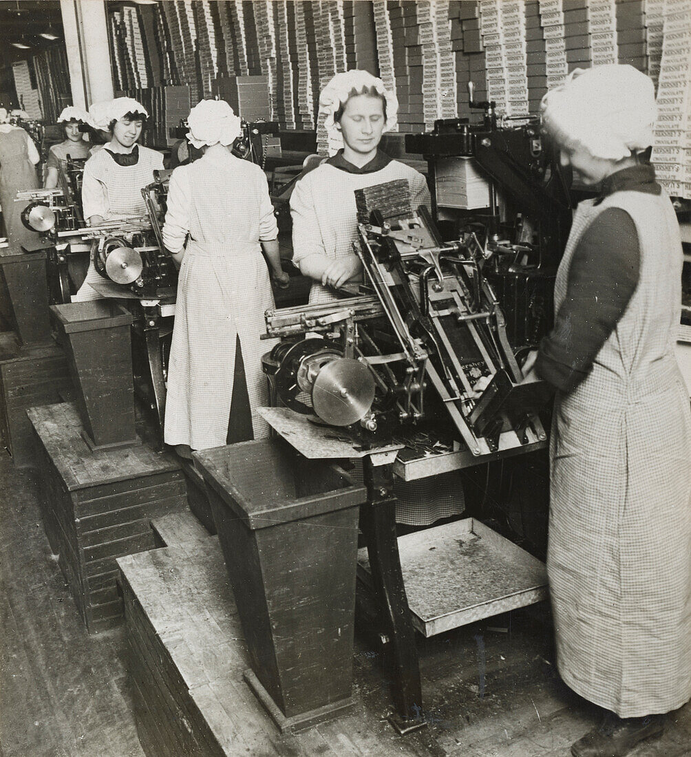 Women wrapping chocolate bars in a chocolate factory