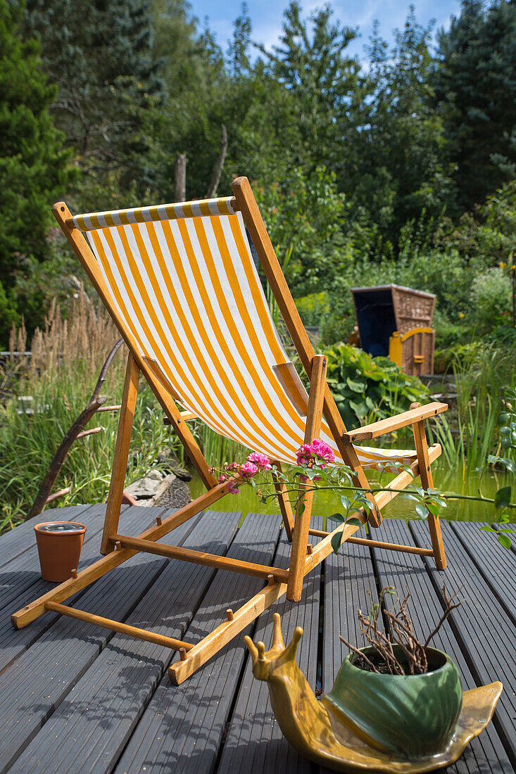 Relaxing chair by a garden pond