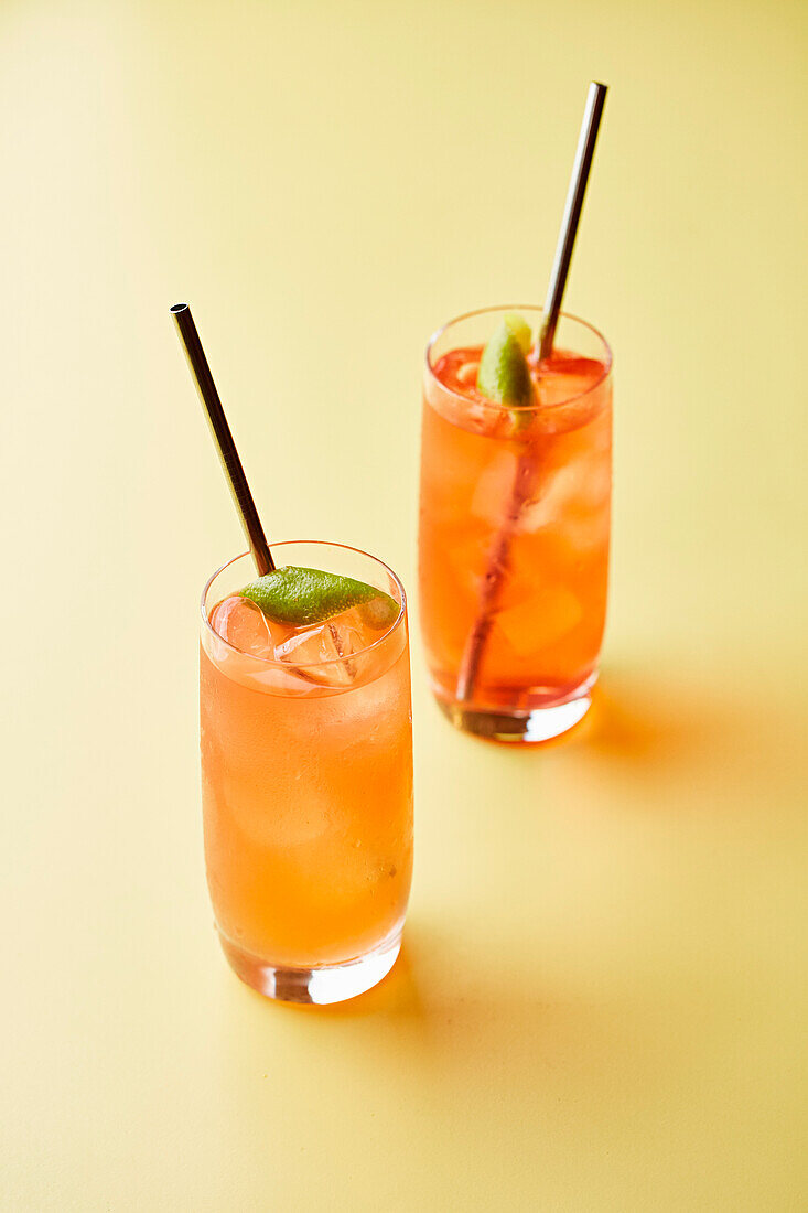Orange cocktail with Lime Garnish