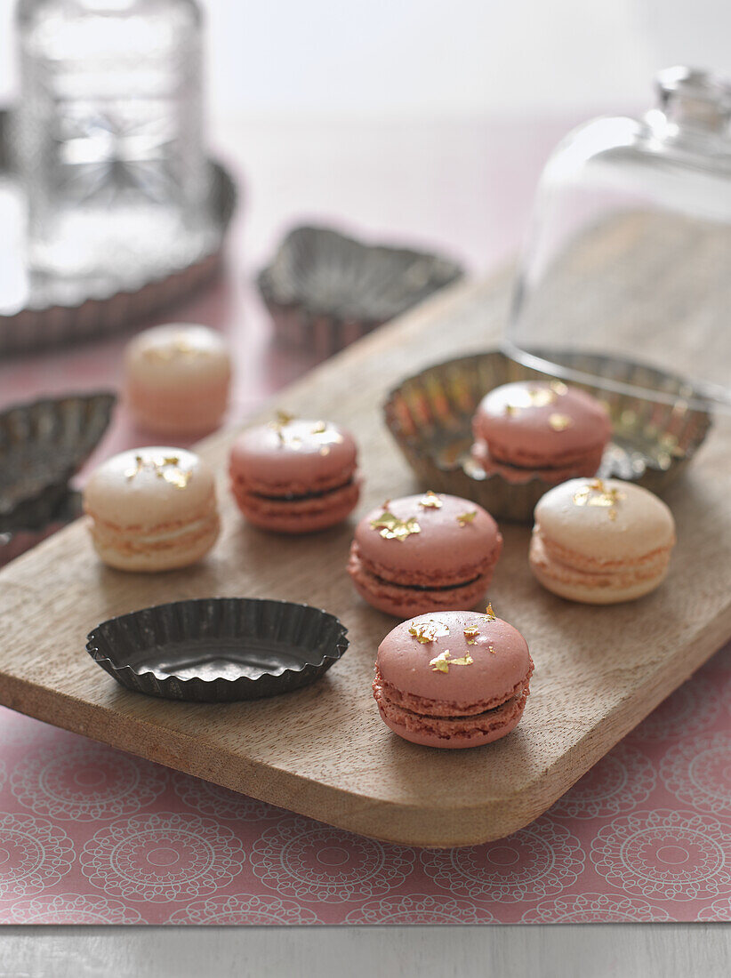 Macaroons decorated with gold leaf
