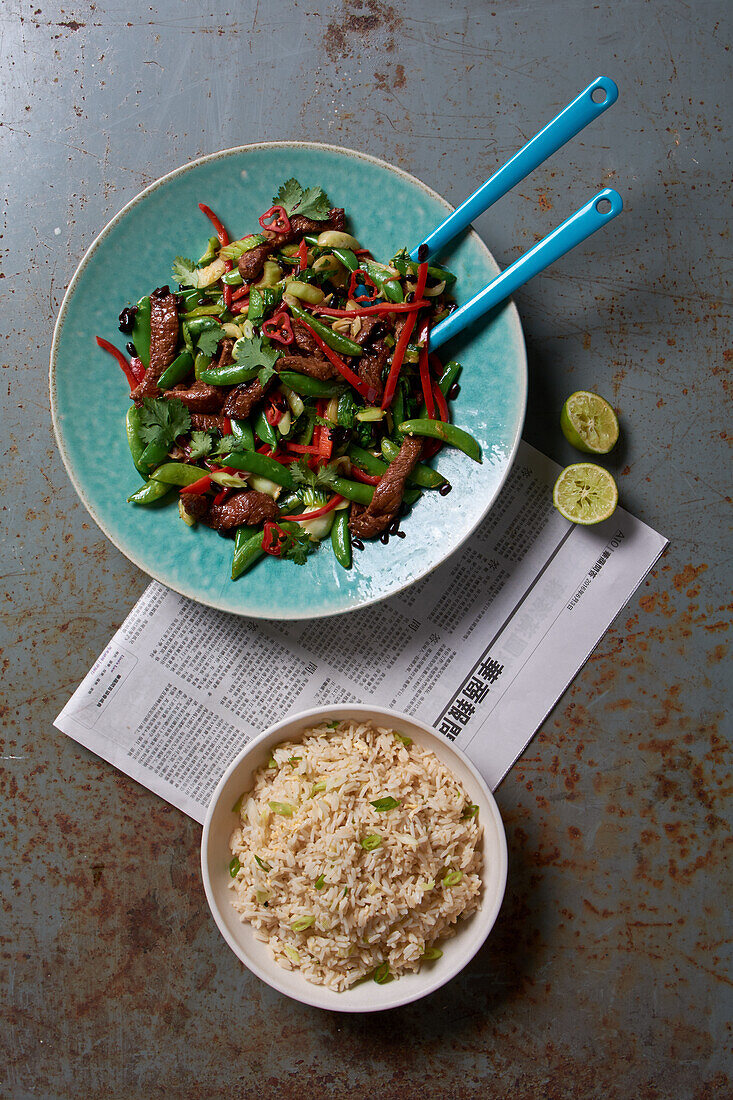 Beef and vegetable stir fry served with rice in a bowl