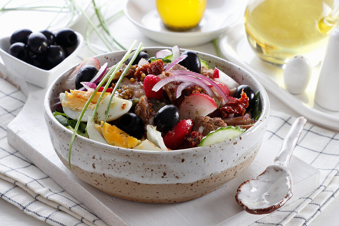 Salad with boiled beef, eggs and vegetables