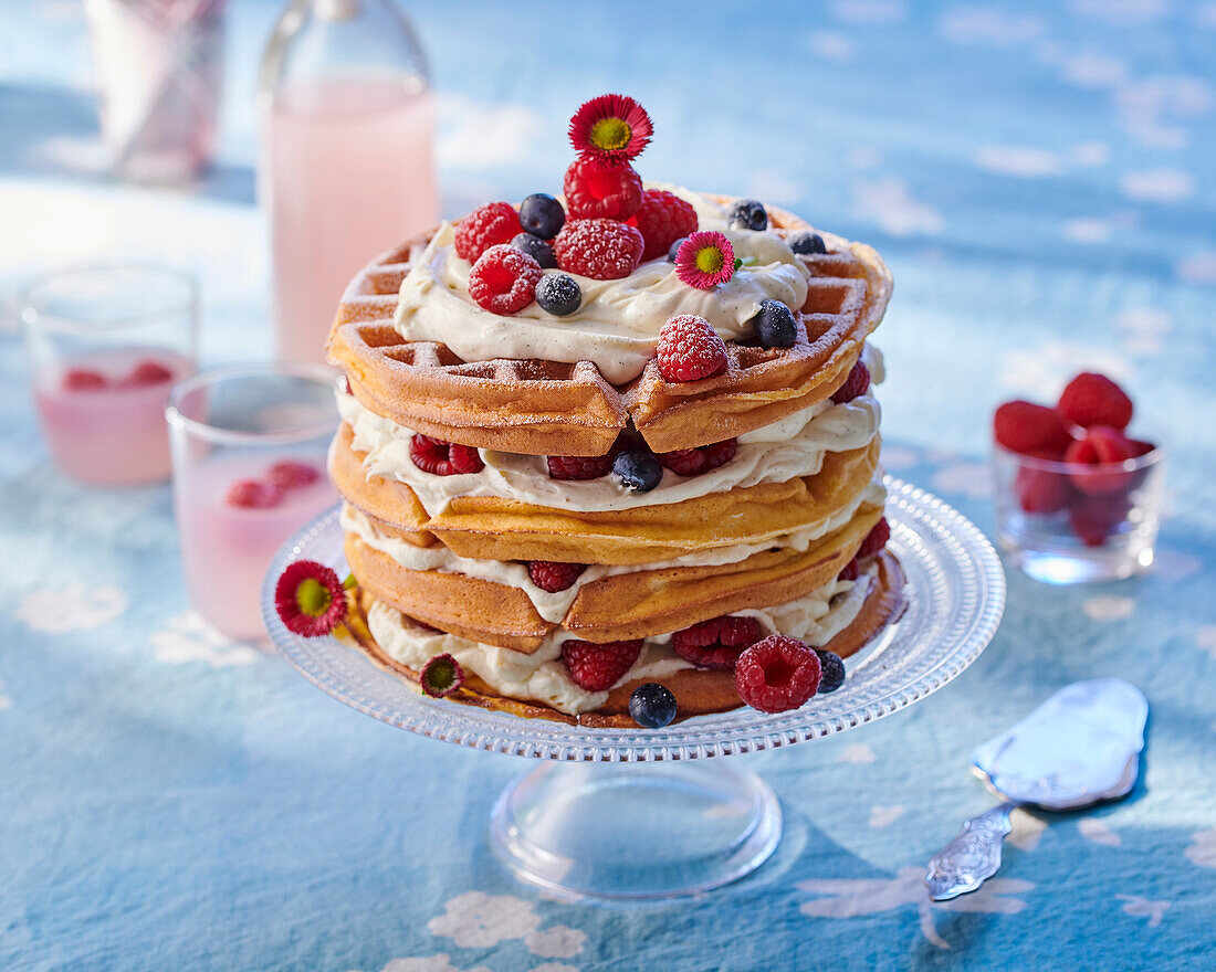 Layered waffle cake with cream filling and summer berries