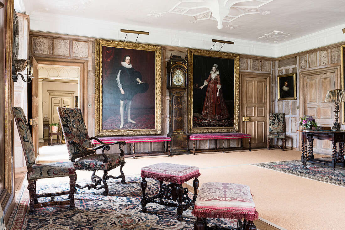 Large Tudor and Jacobean portraits with 17th century upholstered chairs