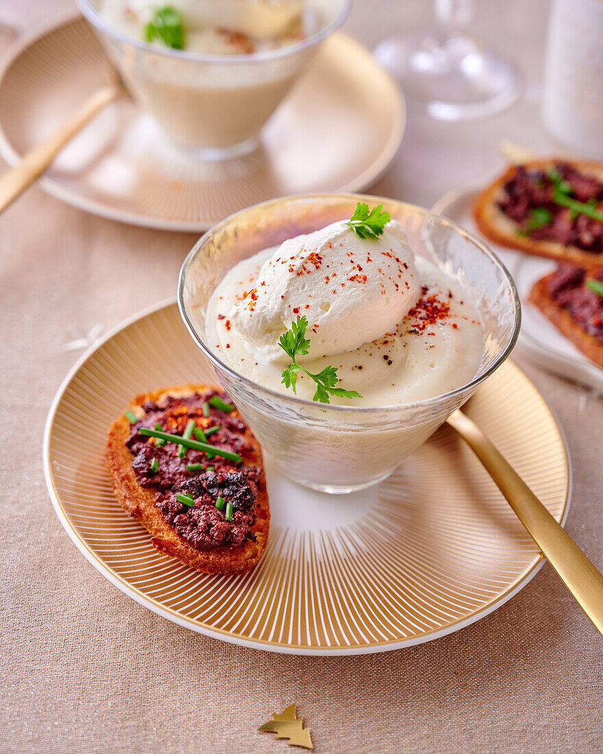 Jerusalem artichoke veloute served with tartine de boudin noir (toasted bread with black pudding, France)