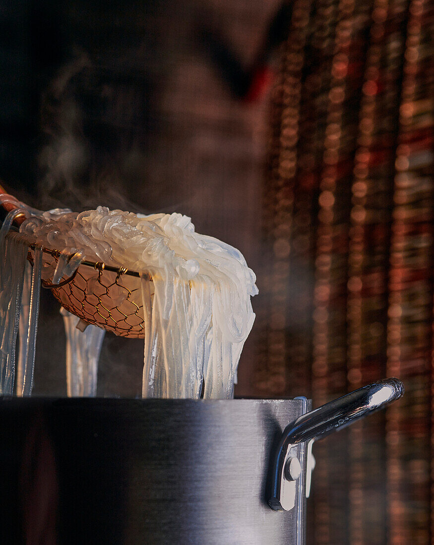 Cooked Rice noodles in a strainer