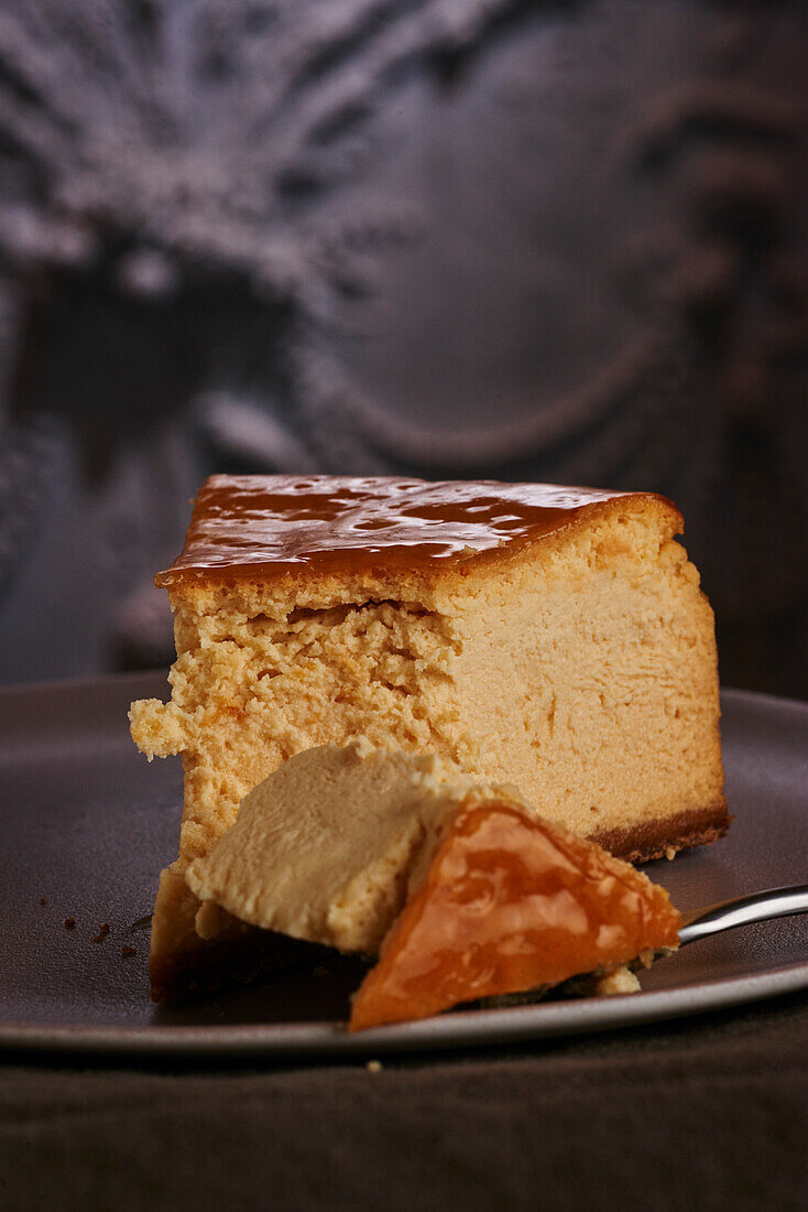 A slice of caramel cheesecake