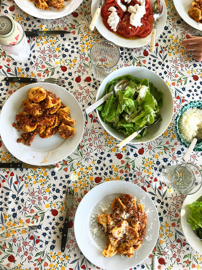 Tordelli (stuffed pasta, Tuscany) served with salads