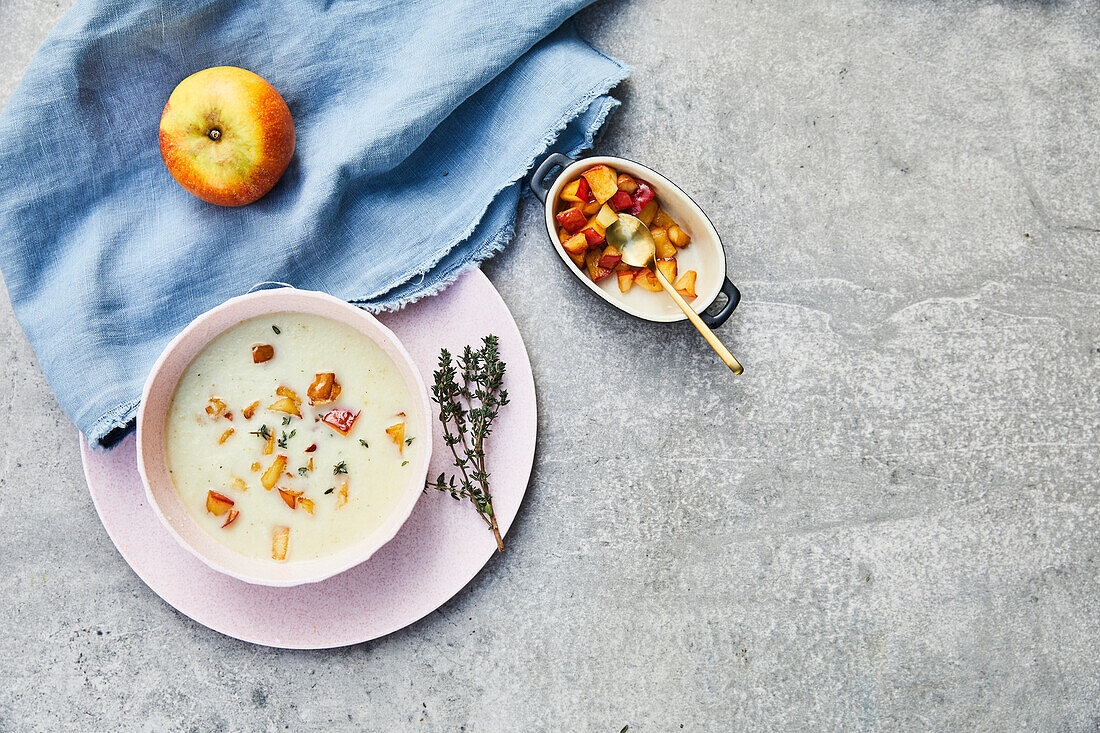 Parsley root soup with apple cubes