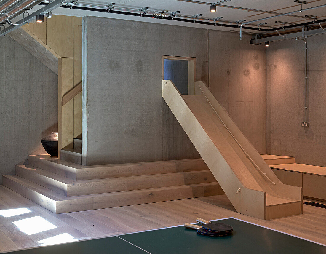 Playroom with wooden slide and table tennis (ping pong) in the basement