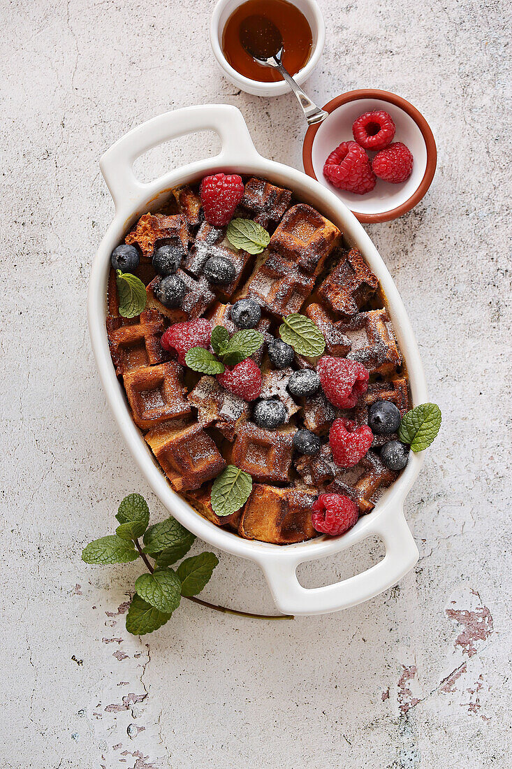 Waffle French toast bake with fresh raspberry, blueberry and mint