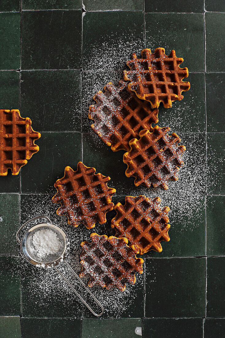 Homemade spicy pumpkin waffles with icing sugar