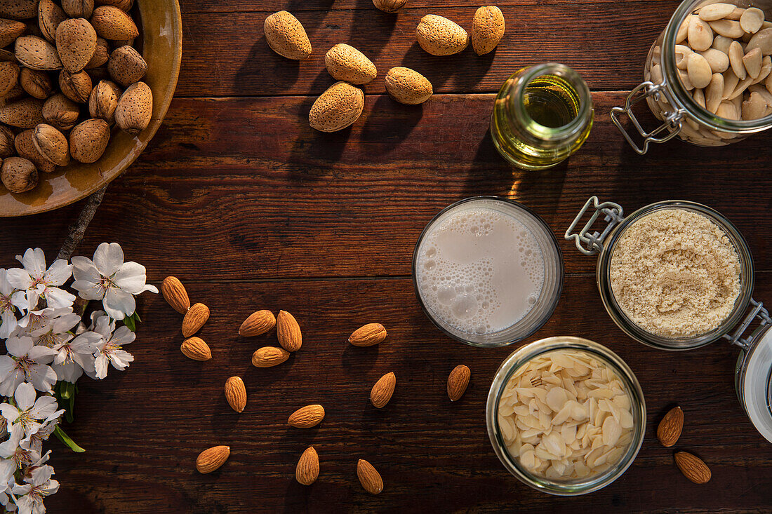 Oil and almonds on wooden table