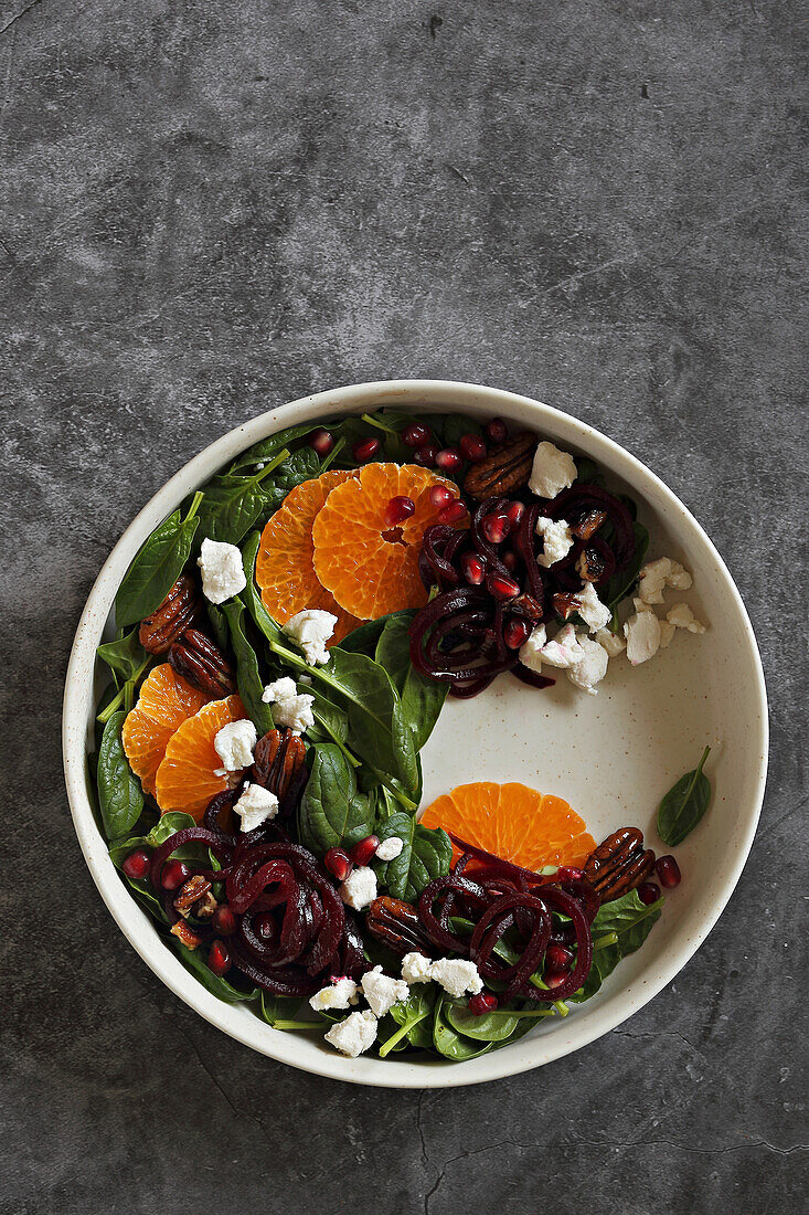 Mandarin Beet Pomegranate Spinach Salad with Feta cheese and caramelized Pecans