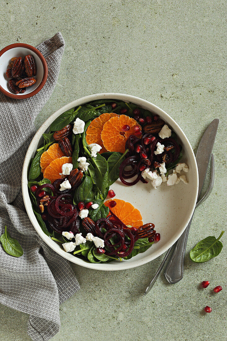 Mandarin beet salad with feta, spinach, and caramelized pecans