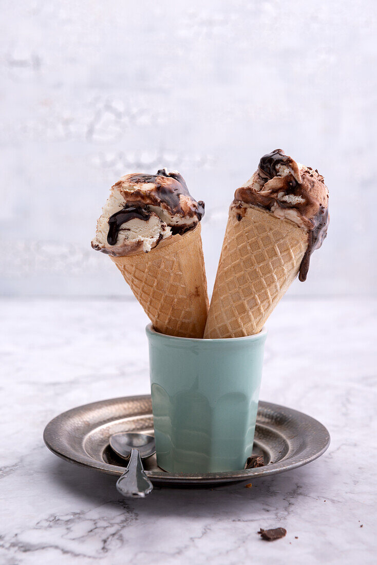 Vegan vanilla and chocolate ice cream in waffle cones