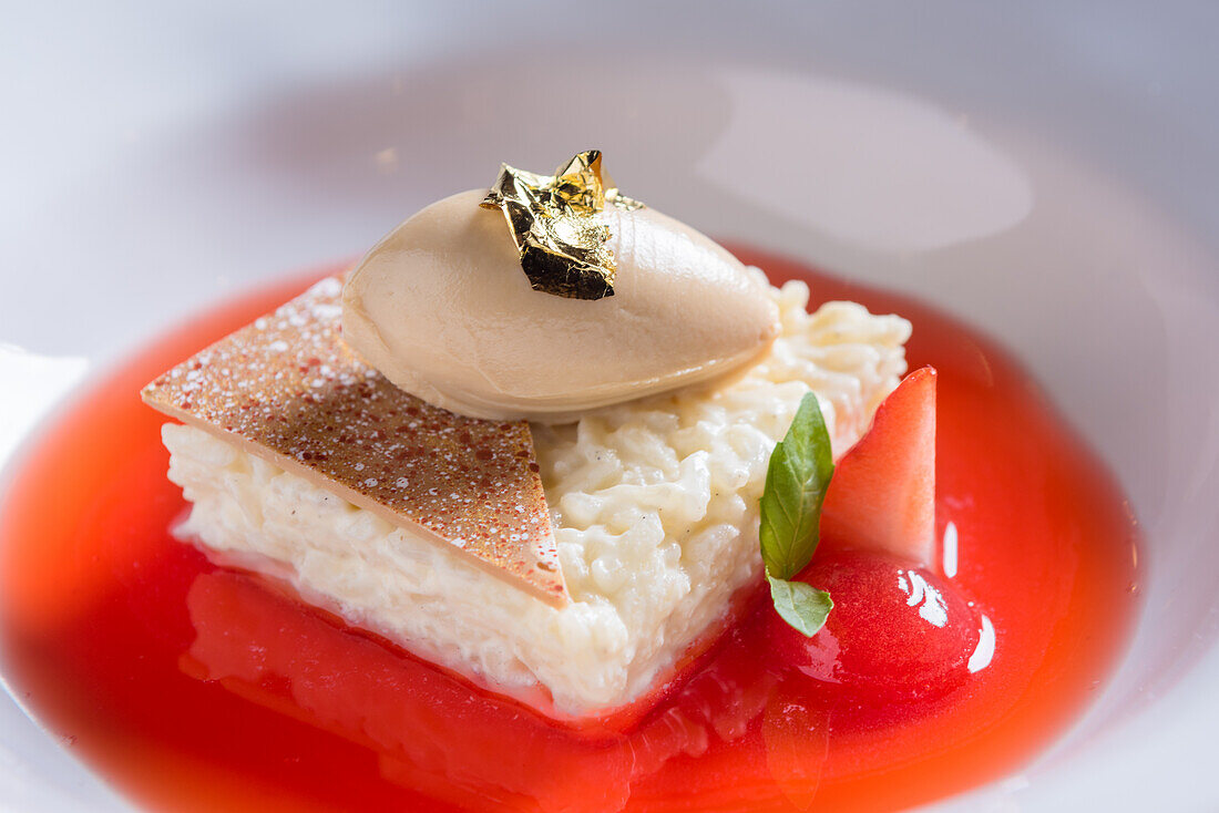 Rice pudding on strawberry coulis