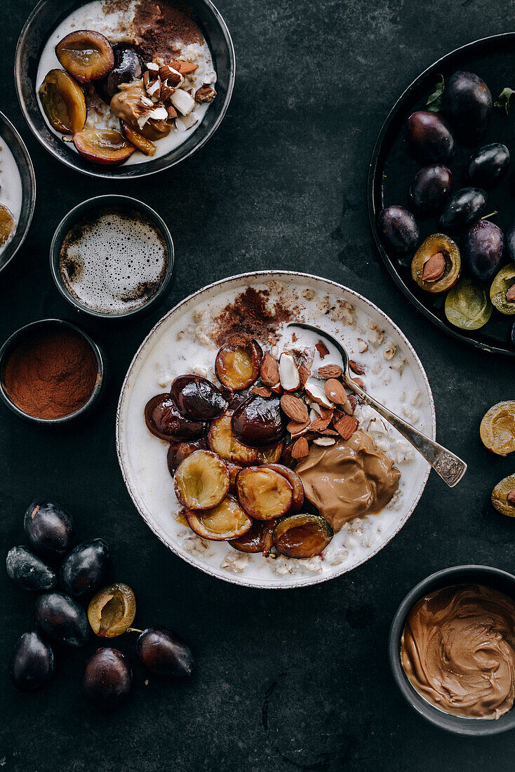 Porridge with plums, almonds, cinnamon, and peanut butter
