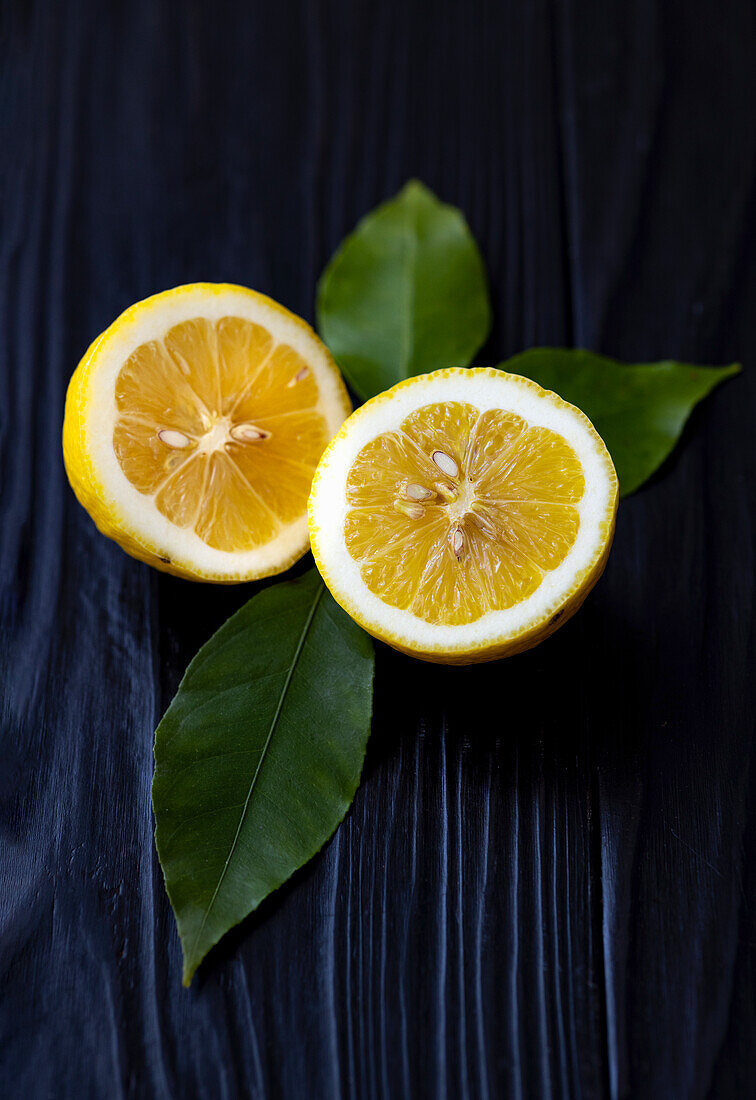 Lemon cut in half with leaves