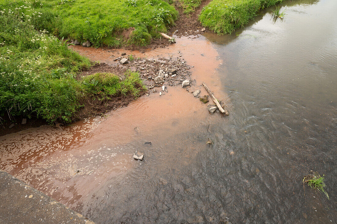 Silt flowing into a river